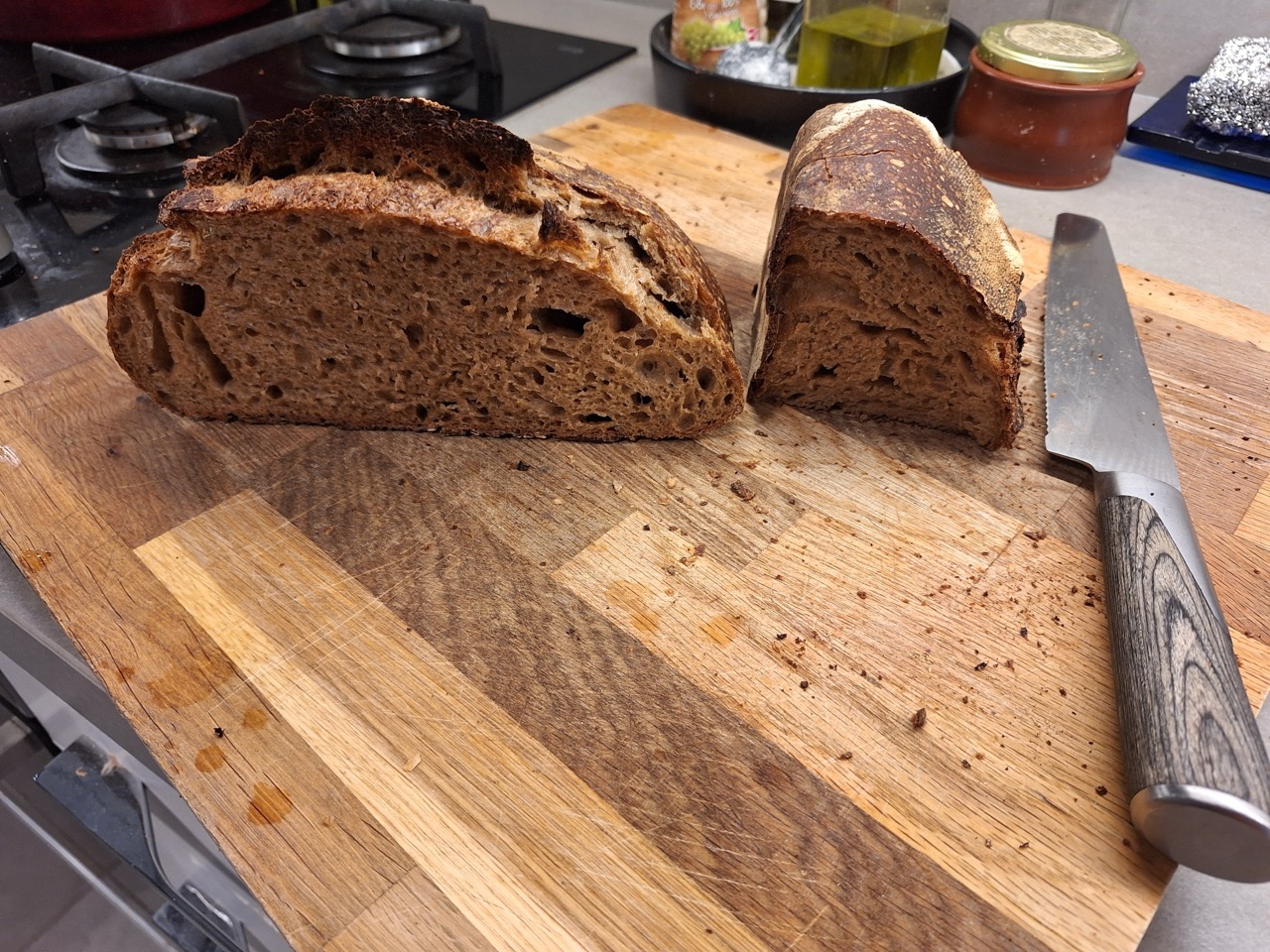 Two halves of a sourdough loaf showing the crumb