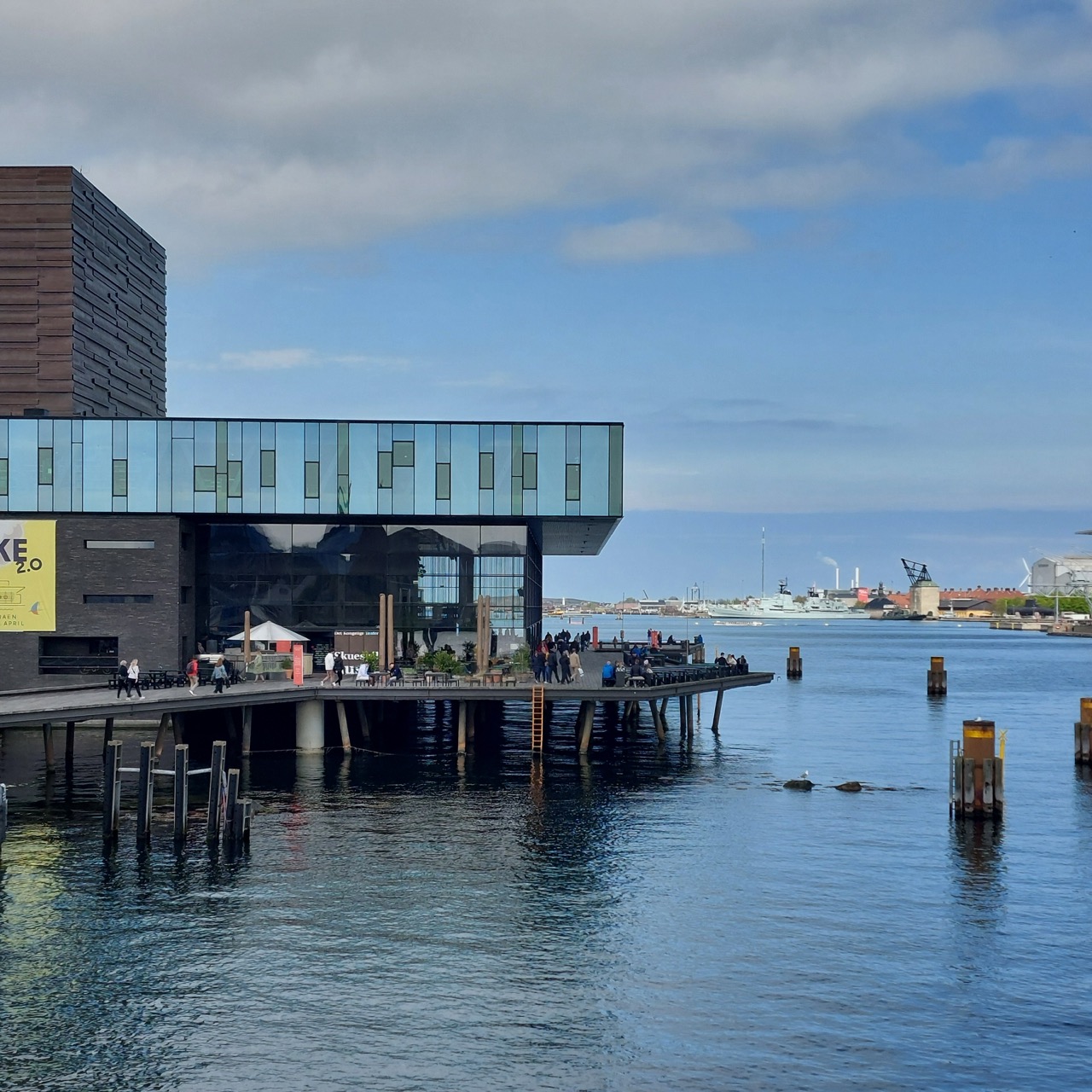 The neoclassical façade of the Statens Museum for Kunst in Copenhagen viewed across a pond